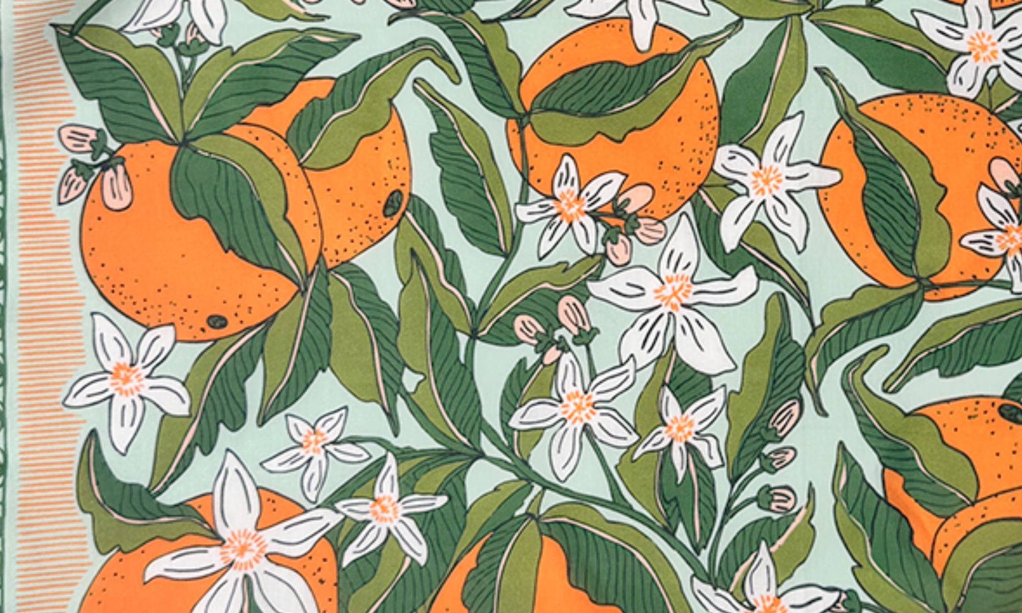 Bandana print with illustrated oranges, white citrus blossoms and green leaves on pale mint background.