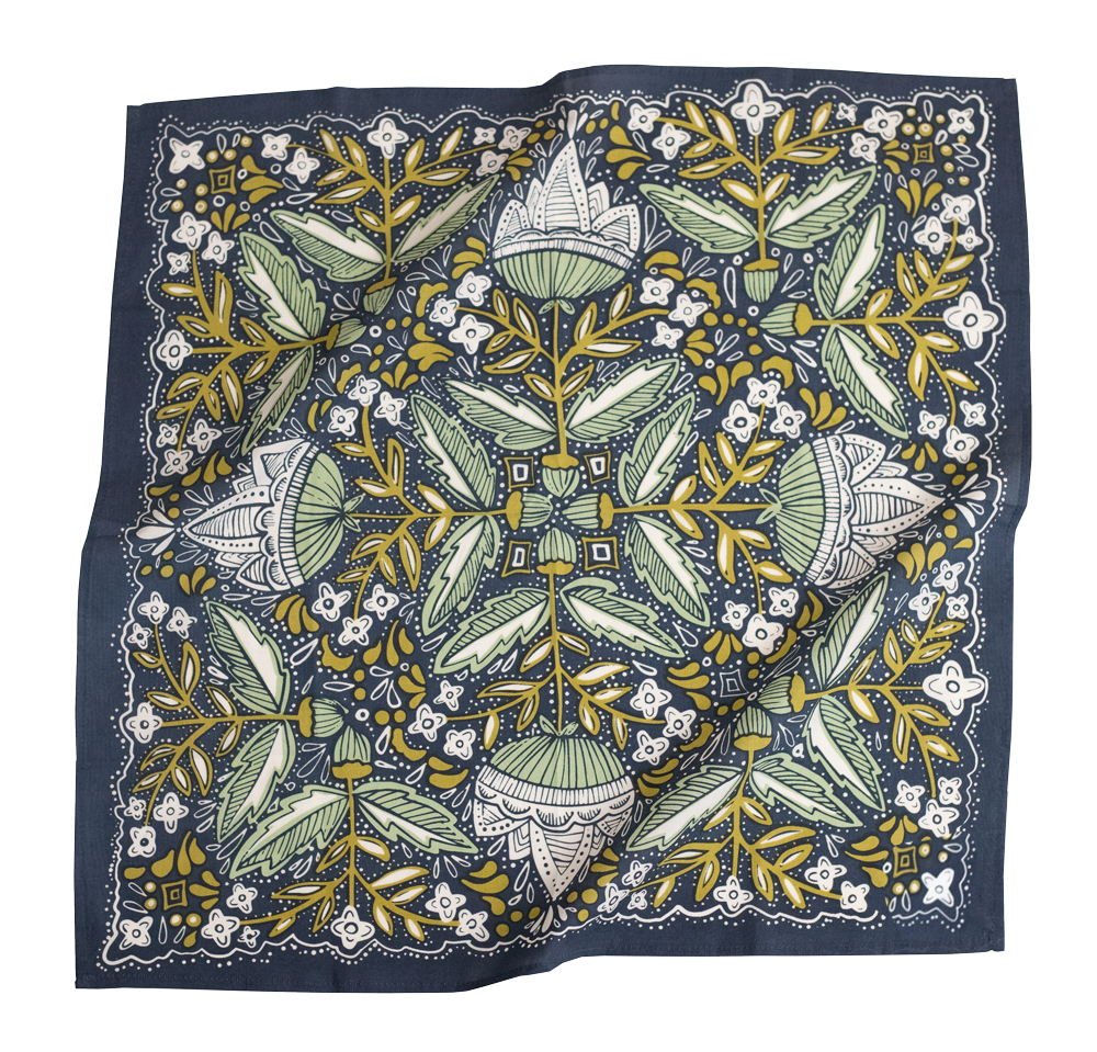 Square scarf with a detailed floral pattern in green, yellow, and white on a dark background.