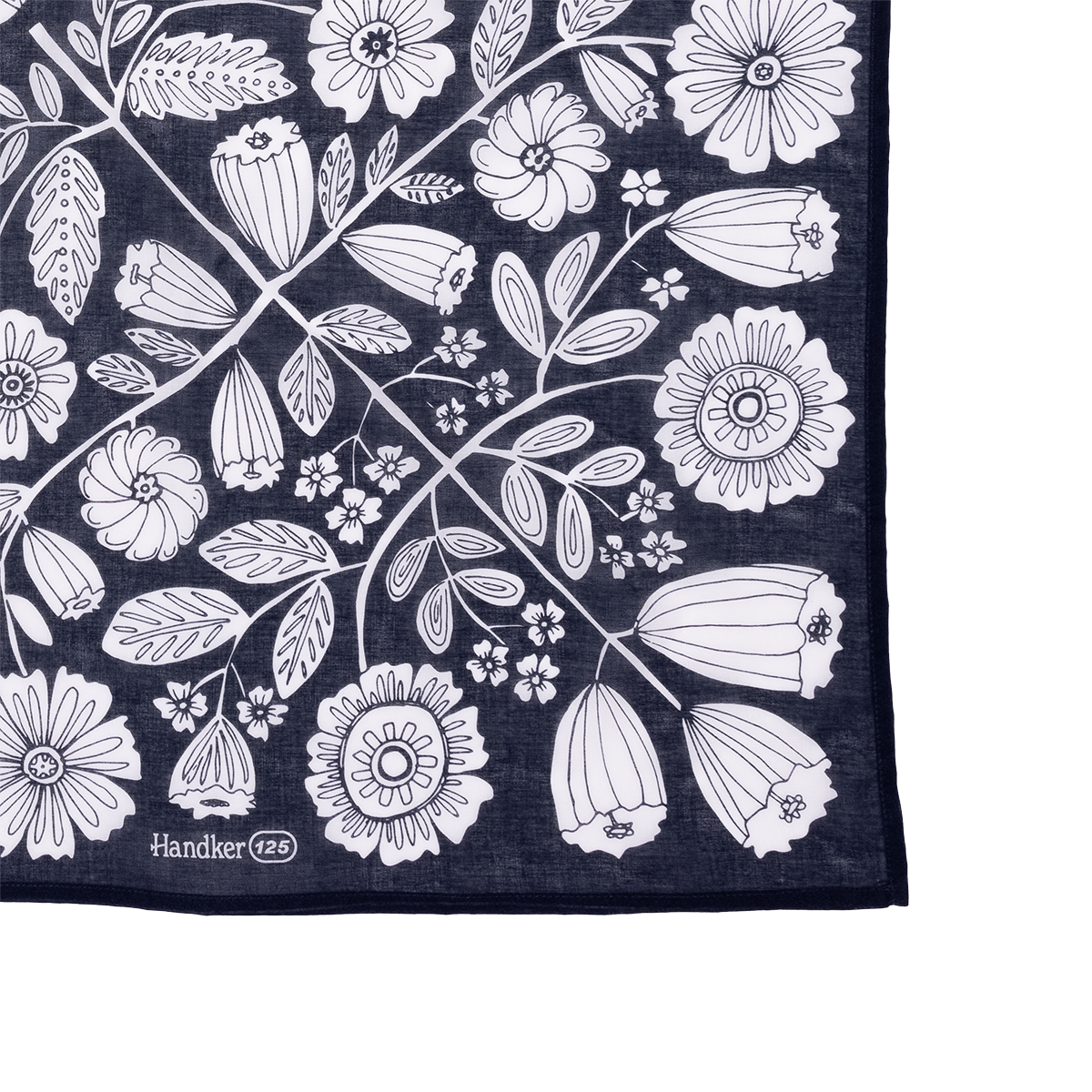 Lower-right close-up of 34 inch Wild Rag Fiona bandana with white floral print and Handker 125 stamp on navy