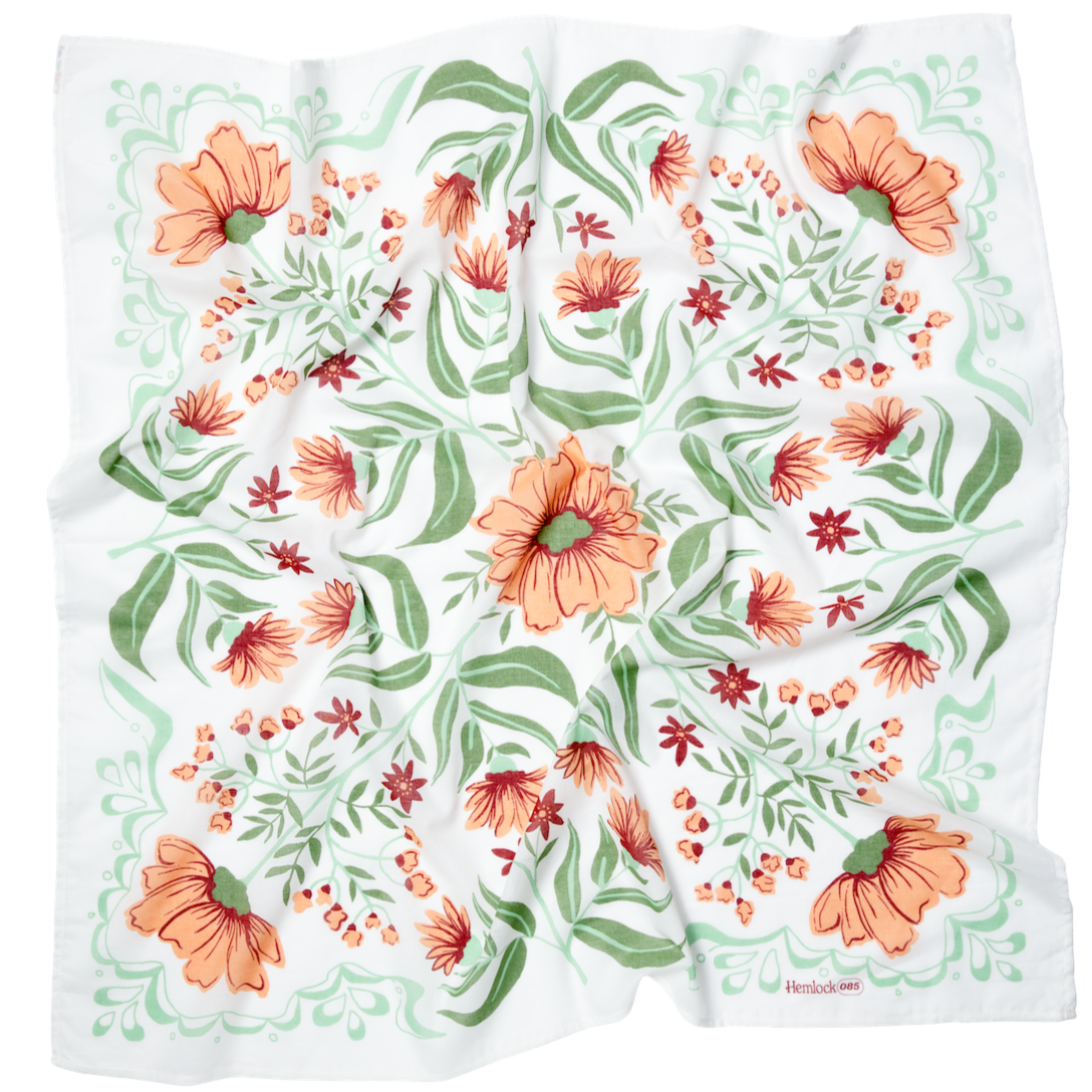 White square scarf with orange flowers and green leaves, corner label 'Hemlock 085'.