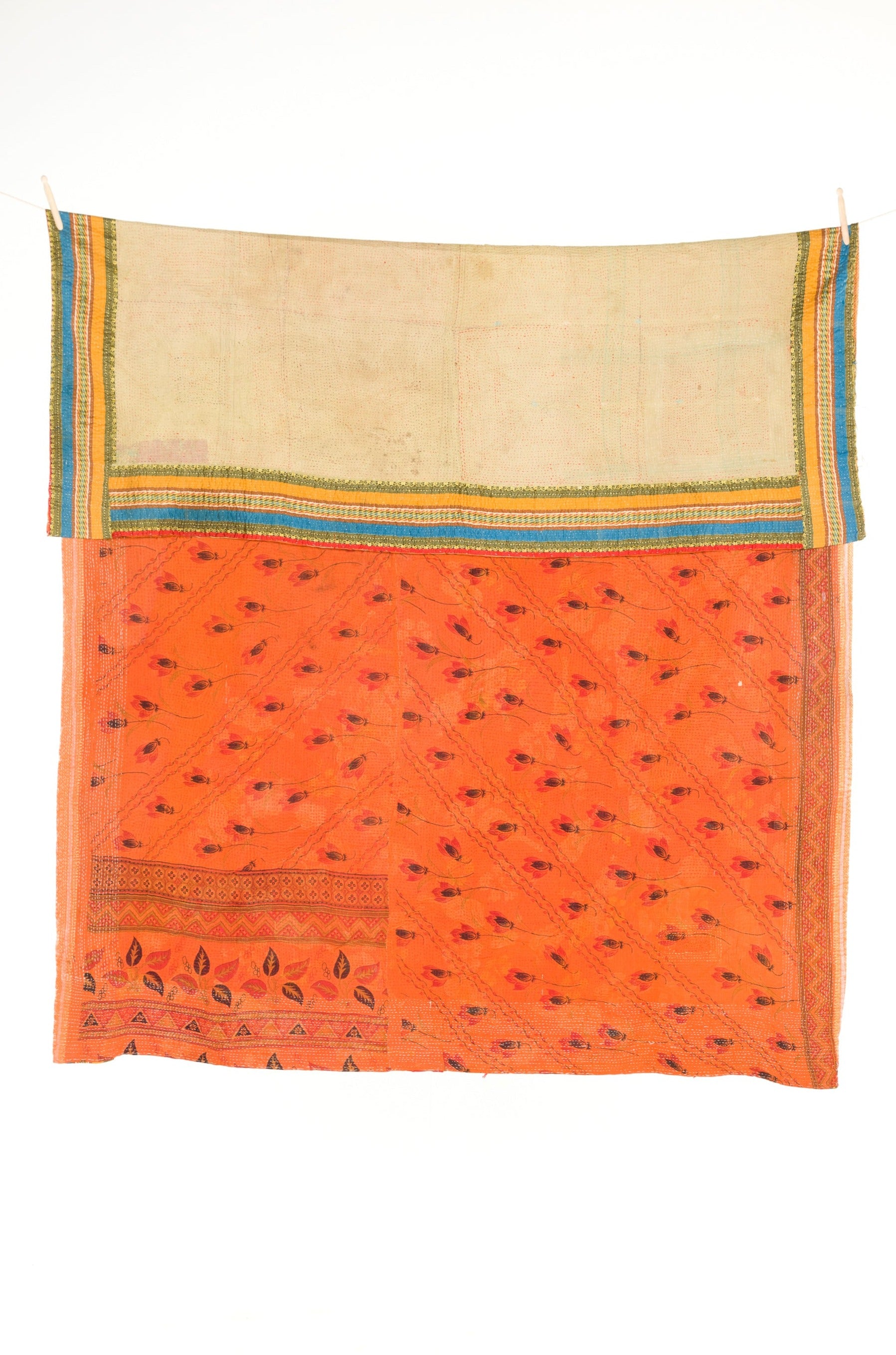 Traditional orange textile with decorative patterns and a blue border