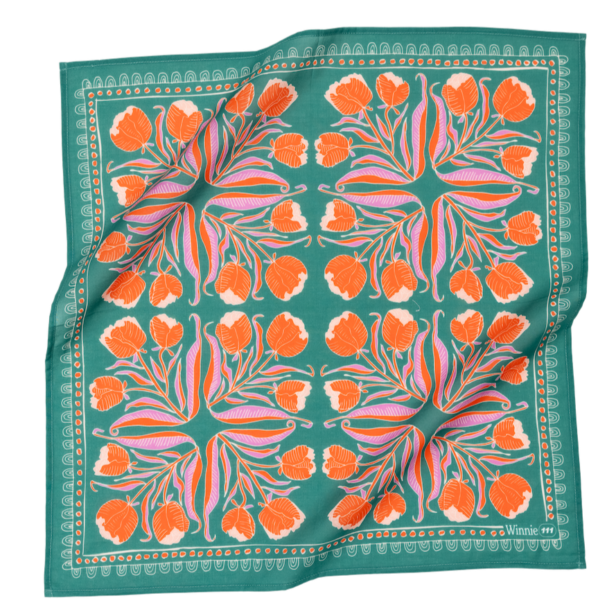 Colorful scarf with floral pattern and turquoise background