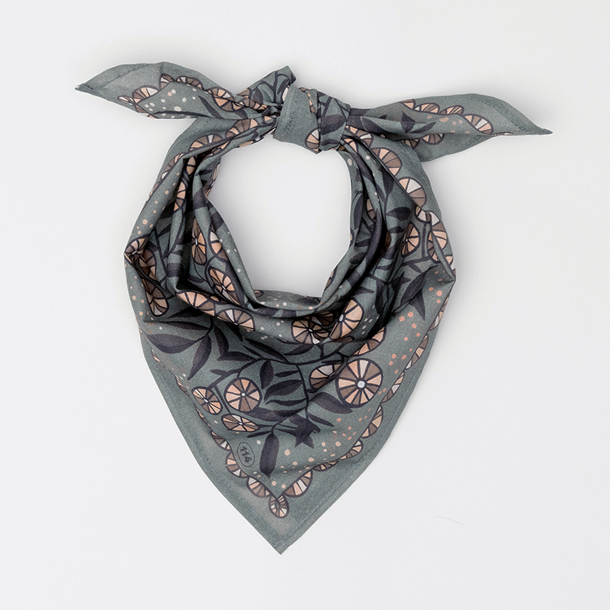 Flat-lay of No. 114 Eleanor bandana tied at top, warm gray cotton with cream and mauve floral and citrus print on white background