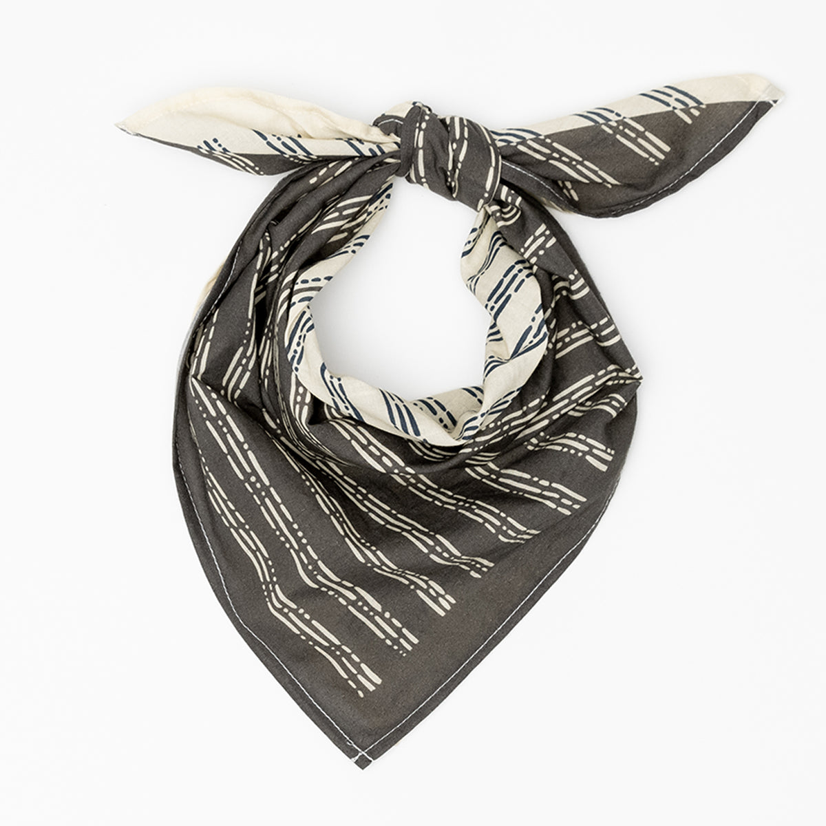 Black and white patterned bandana with knotted ends