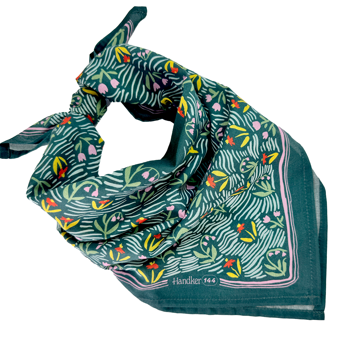 Teal silk square scarf with stylized yellow-and-white flowers and zebra-striped leaves, folded into a loose triangle.