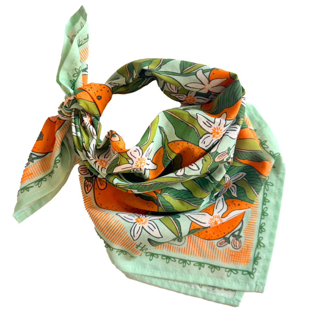 Tied bandana with oranges and white florals on a mint background