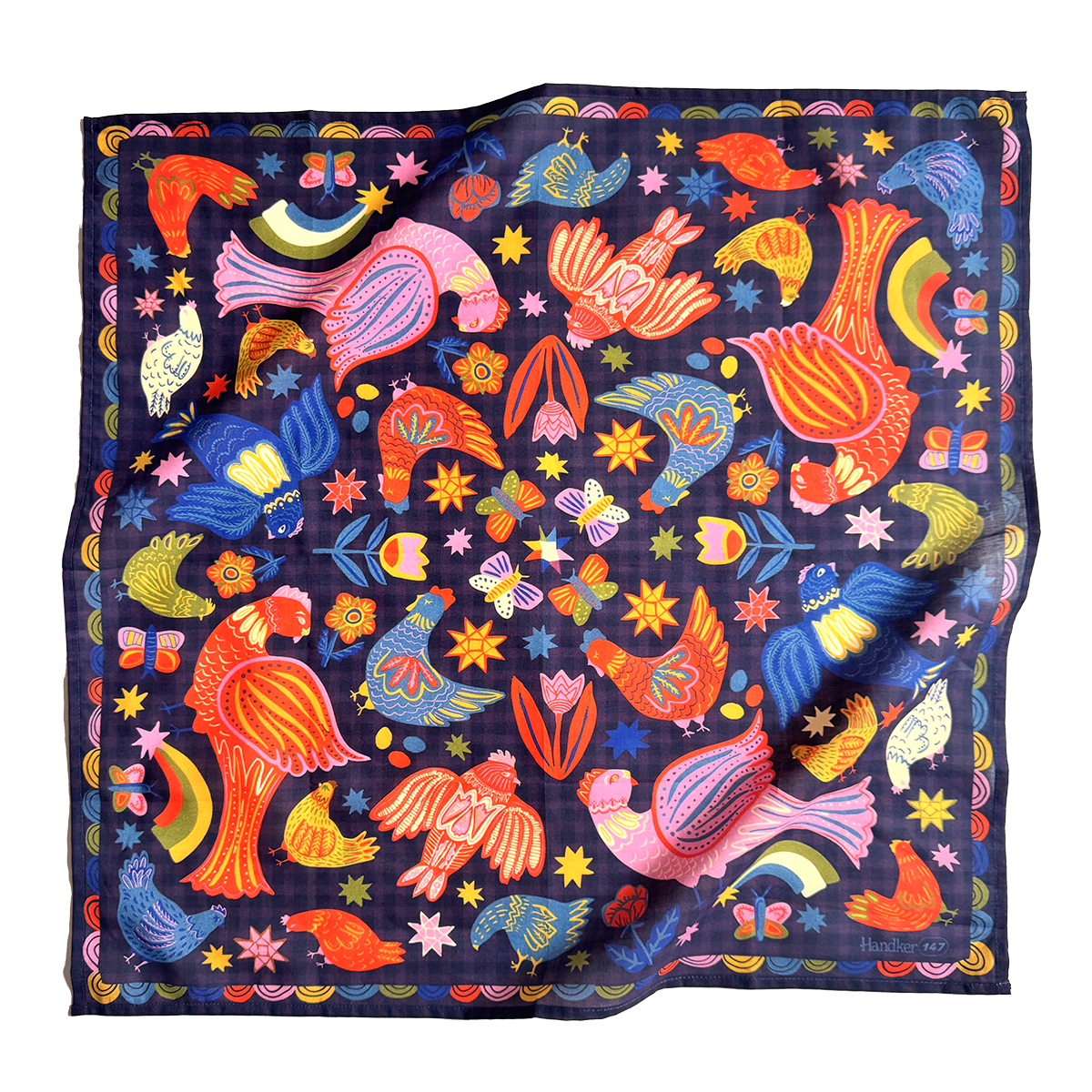 Colorful patterned bandana with birds and abstract designs on a dark background