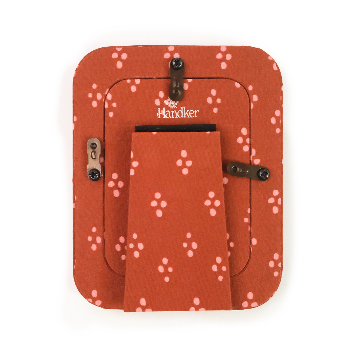 Back of Handker fabric tabletop frame with red and pink dotted pattern