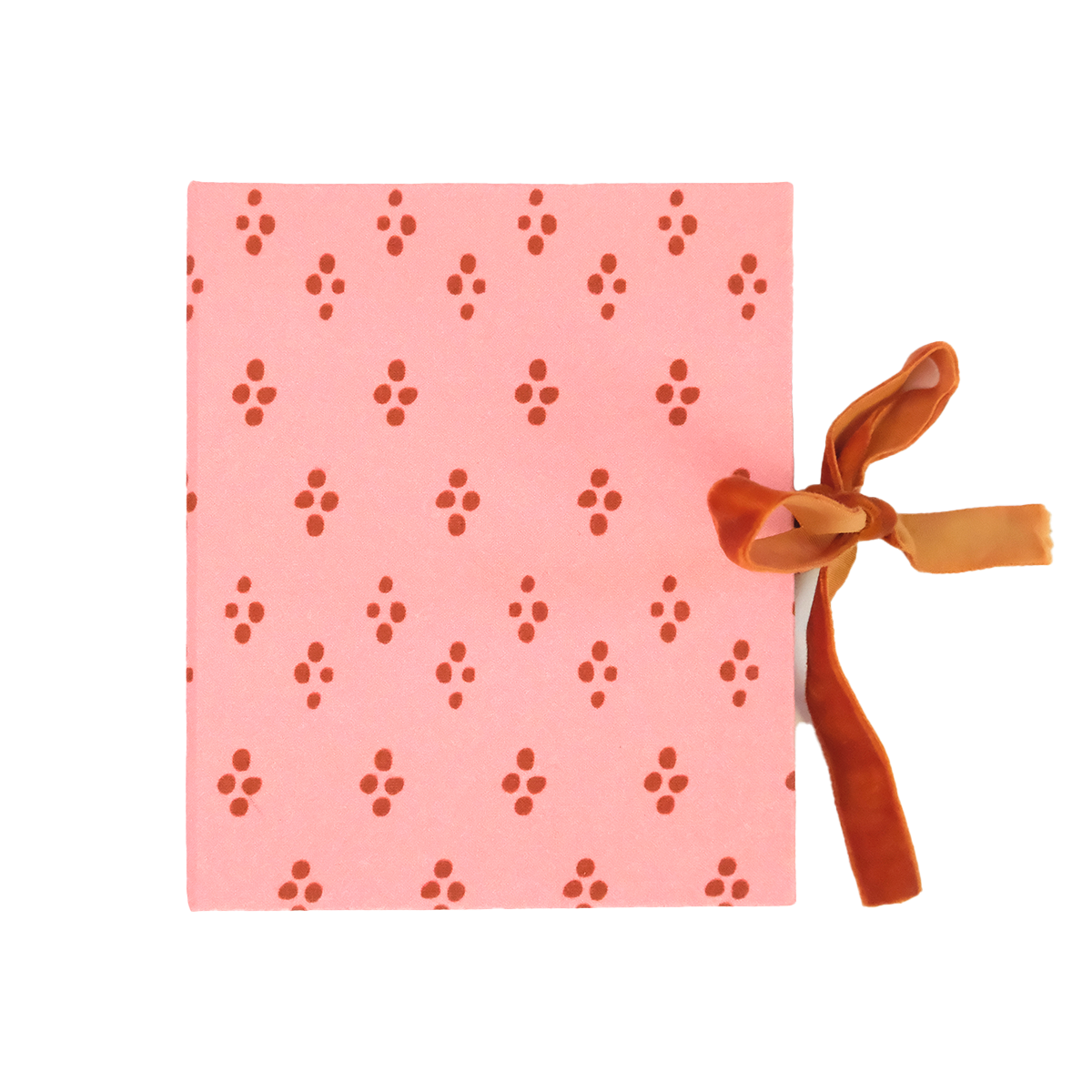 Pink square gift box with red diamond pattern and an orange ribbon tied at the right