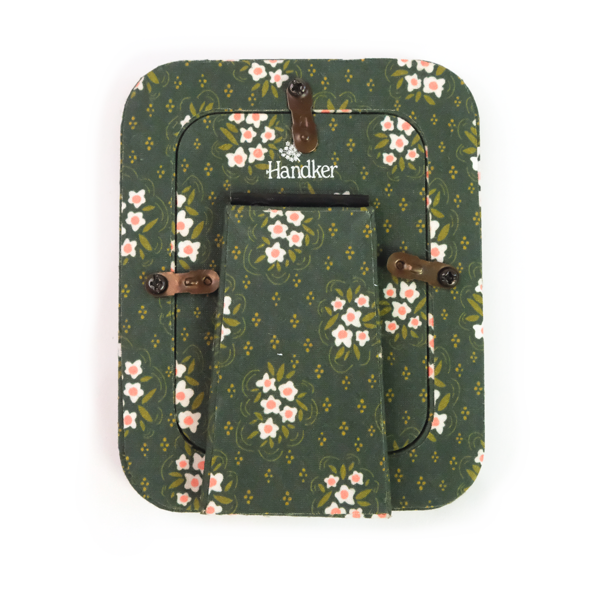 Back of Handker standing fabric tabletop frame with green floral pattern