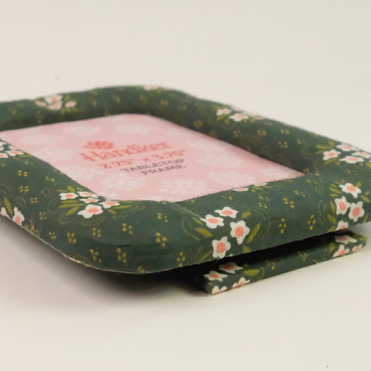 Handker fabric tabletop frame with green floral pattern