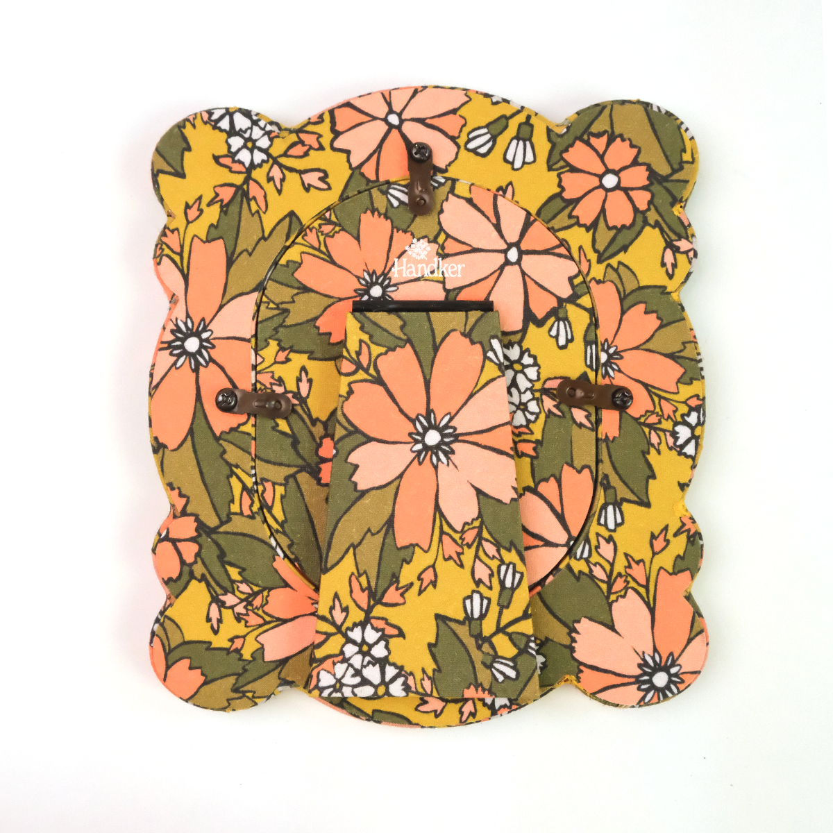 Back of standing fabric tabletop frame with nostalgic yellow floral pattern