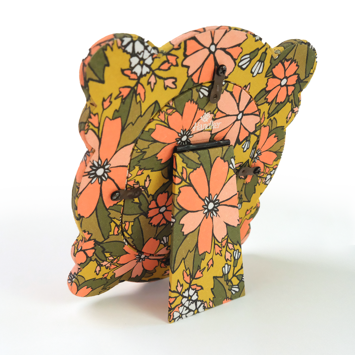 Back of standing fabric tabletop frame with nostalgic yellow floral pattern