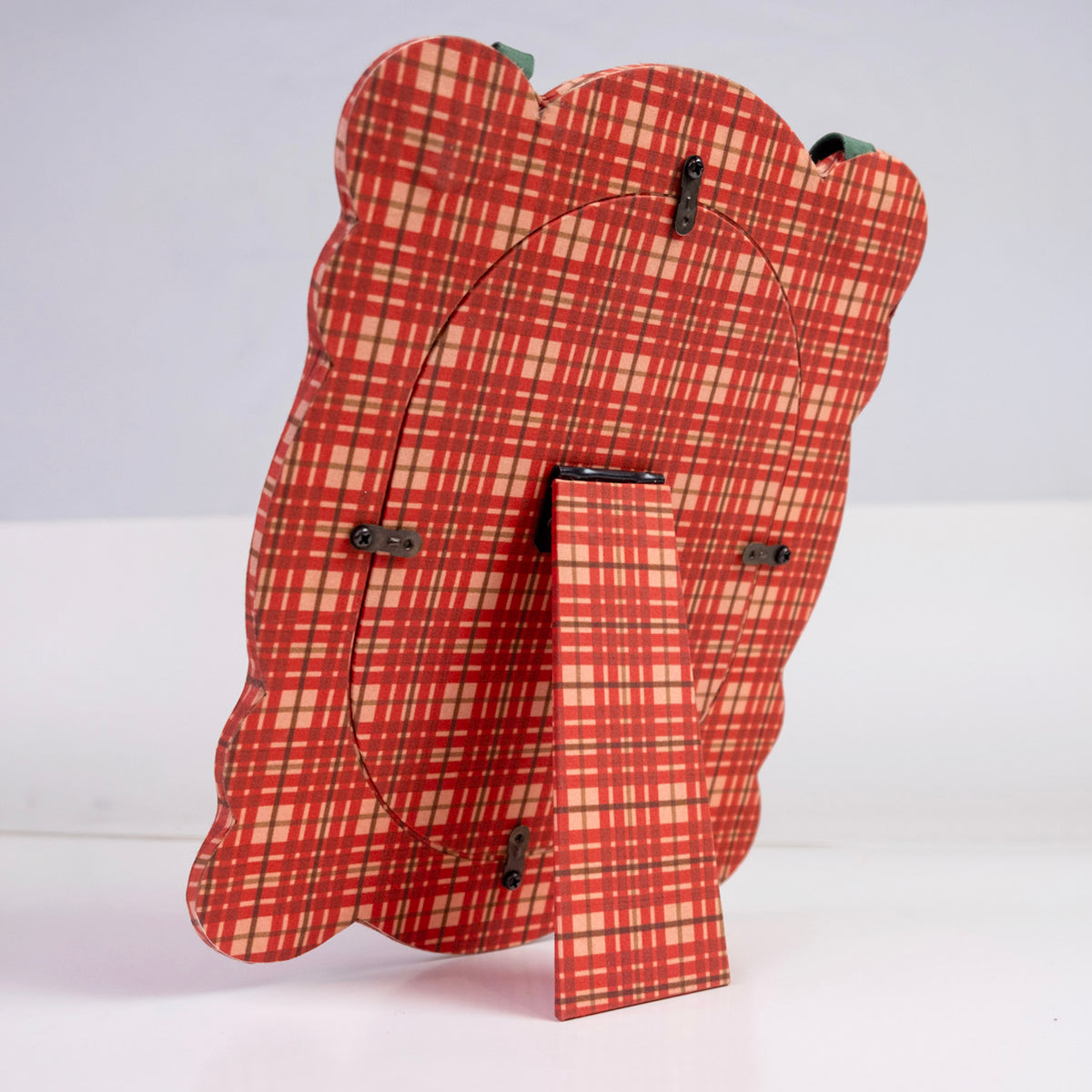 Rear view of Marley 8x10 fabric desktop frame showing red and cream plaid fabric, easel stand and hanging hardware on a white background