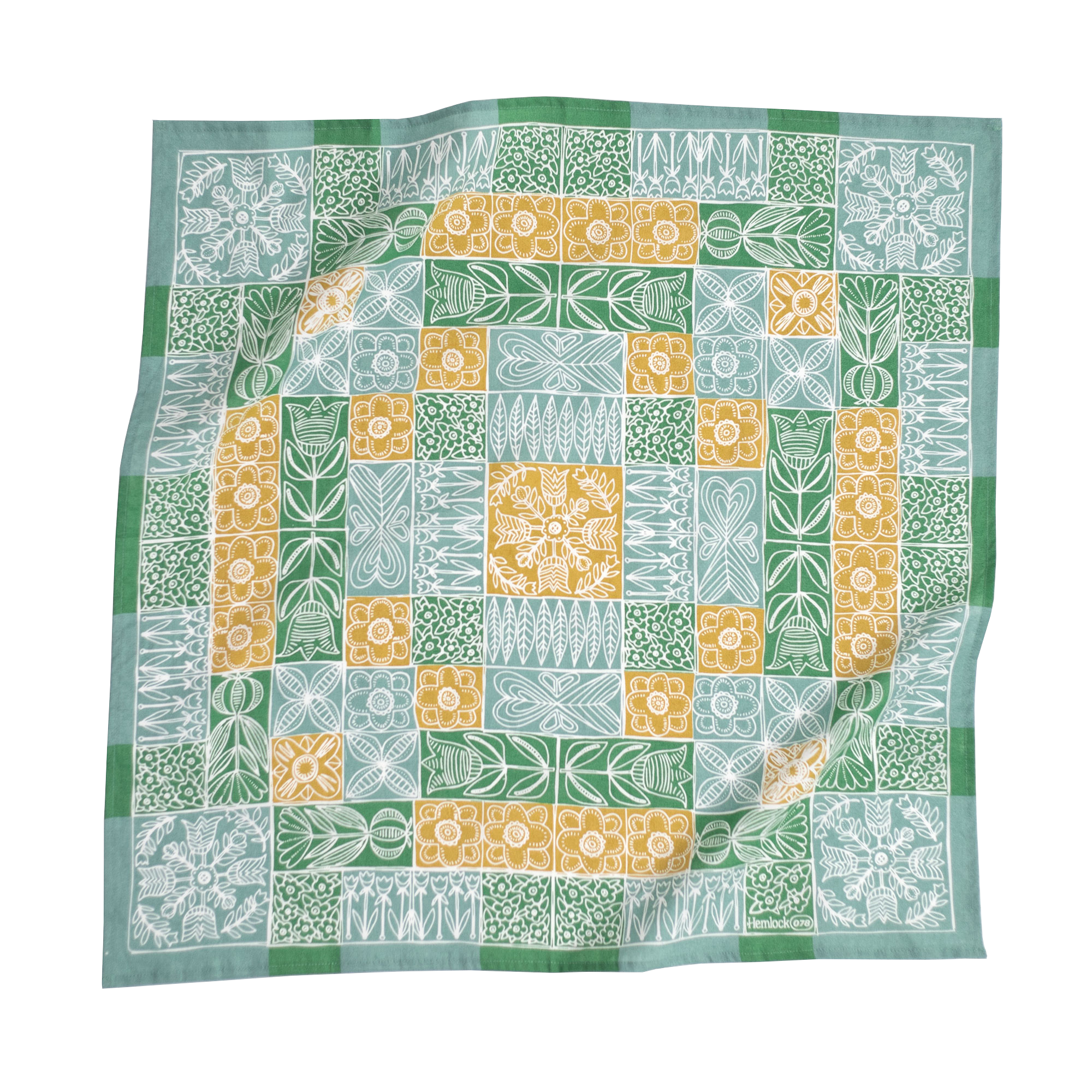 Colorful quilt with green, blue, and yellow geometric patterns
