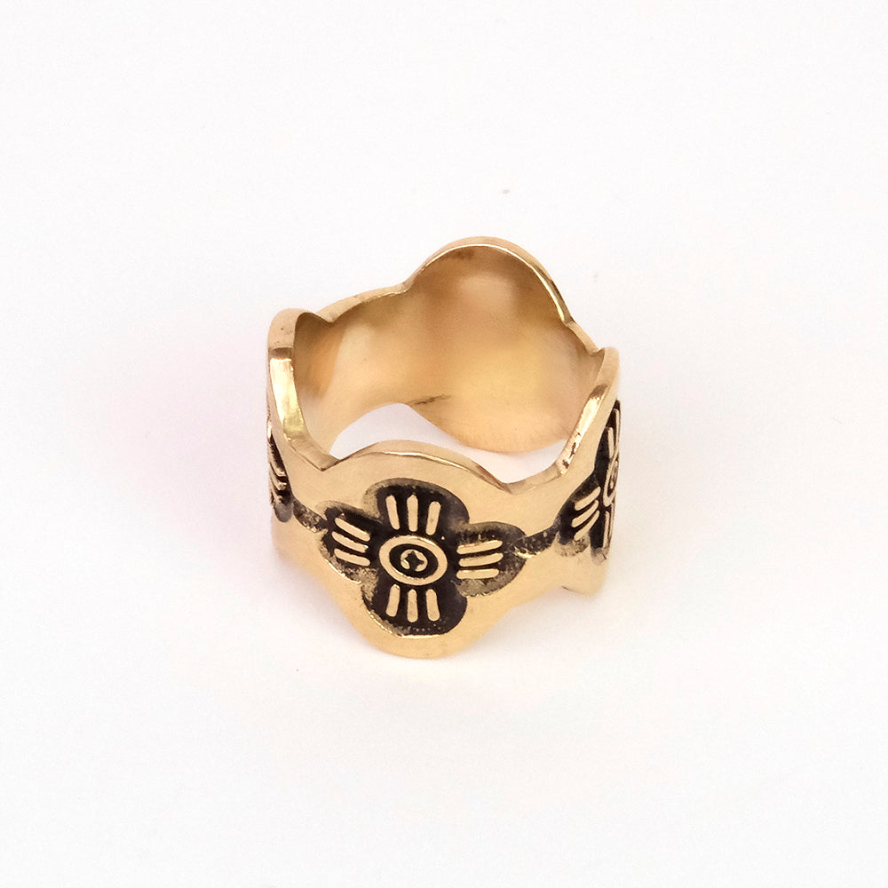 Gold ring with engraved tribal design