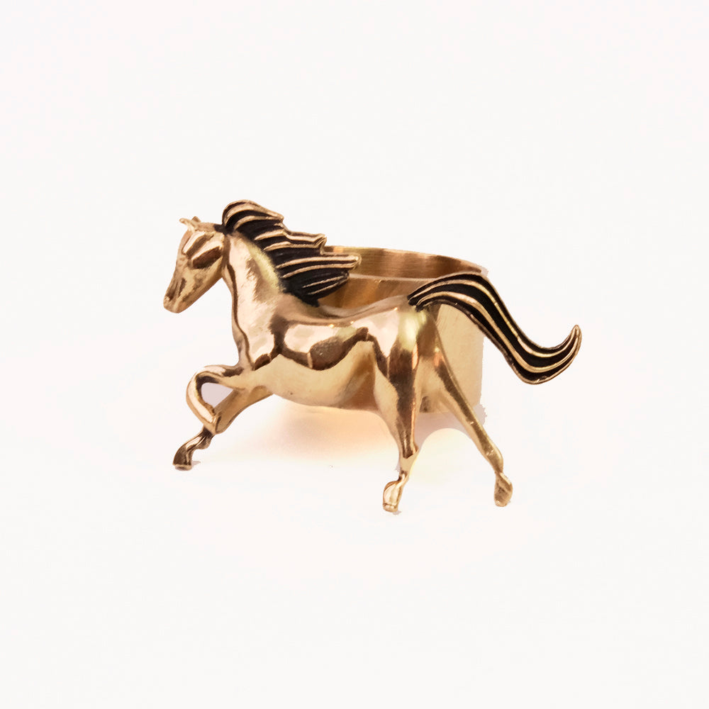 Polished brass horse figurine mid-gallop with flowing mane on white background.
