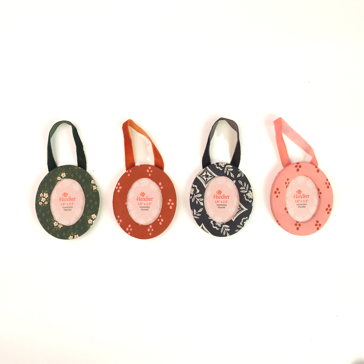 Four colorful fabric ornament photo frames with velvet ribbons for hanging