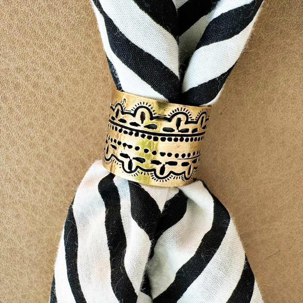 Striped scarf with decorative gold ring