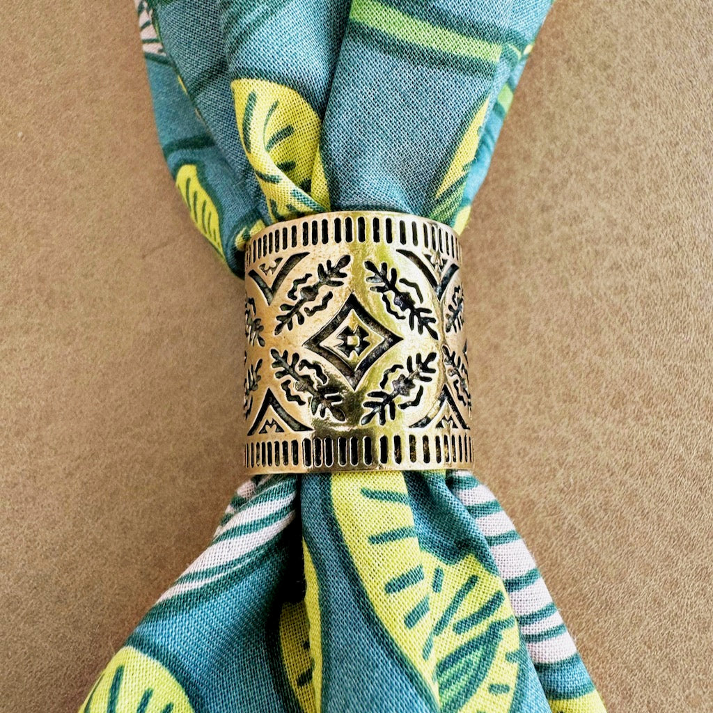 Decorative napkin ring on a patterned napkin