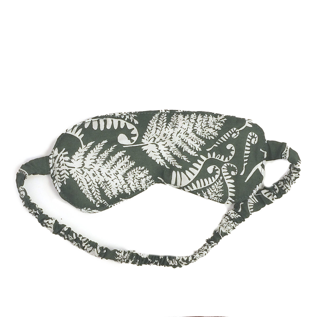 Green sleep mask with white fern pattern and ruched elastic strap
